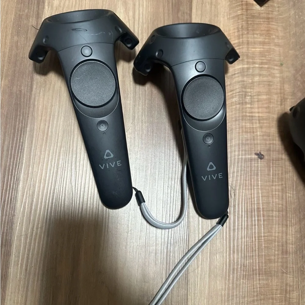 HTC VR Headset with Black Controllers and Sensors